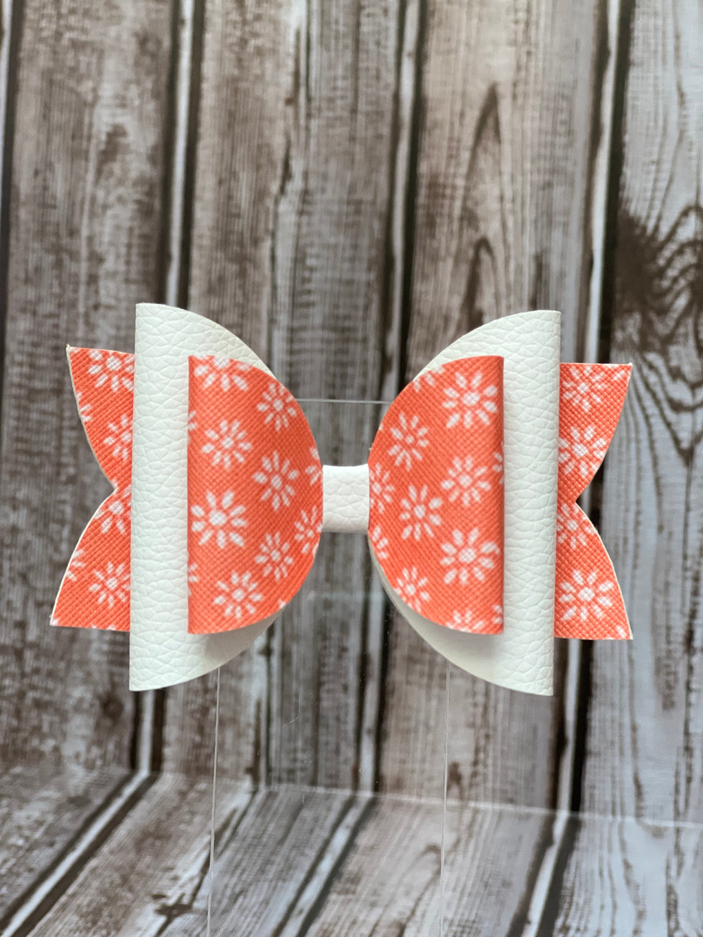 4inch orange with white flowers/white faux leather bow